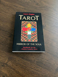 Framsidan av boken Tarot: Mirror of the Soul av Gerd Ziegler, svart omslag med färgglatt kors i mönstrad ram